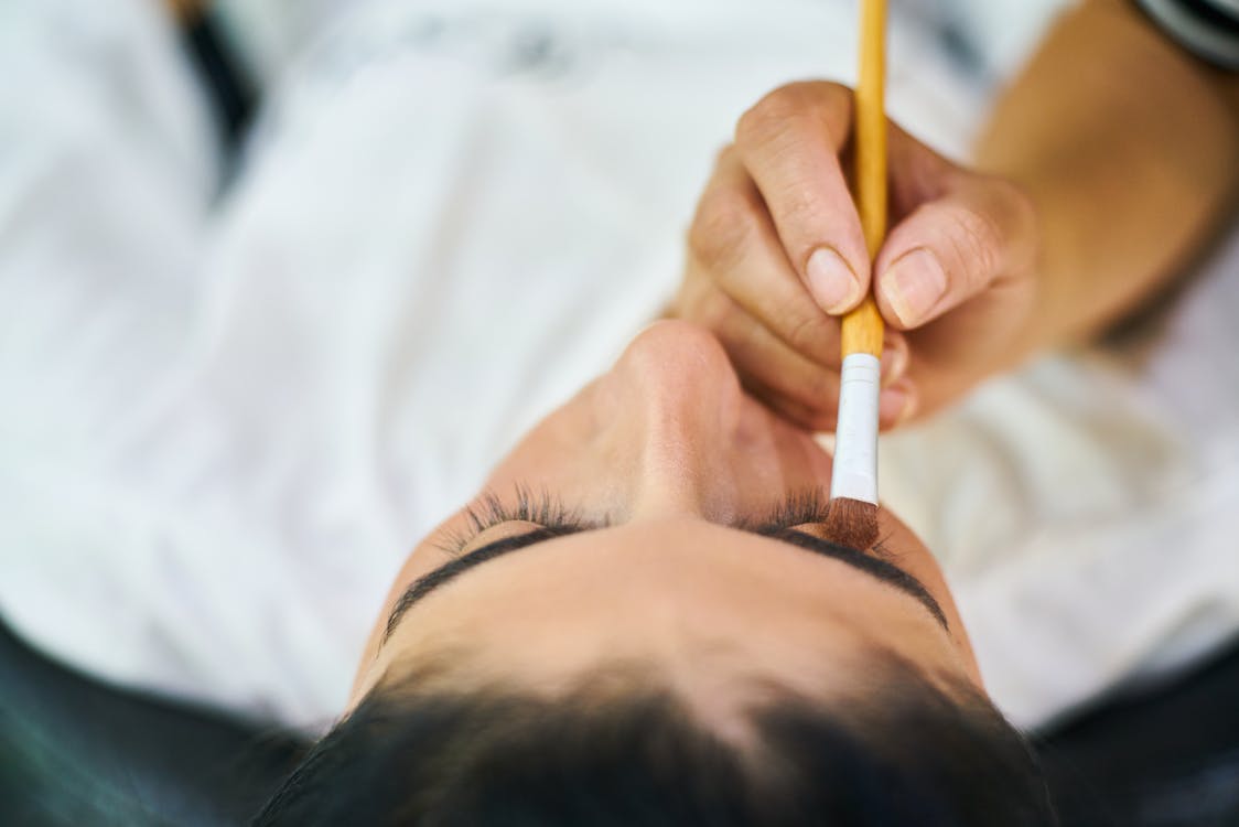 Free Person Holding Makeup Brush Stock Photo