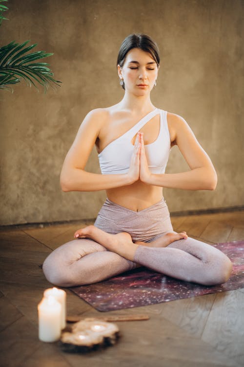 Free Woman Practicing Yoga Stock Photo